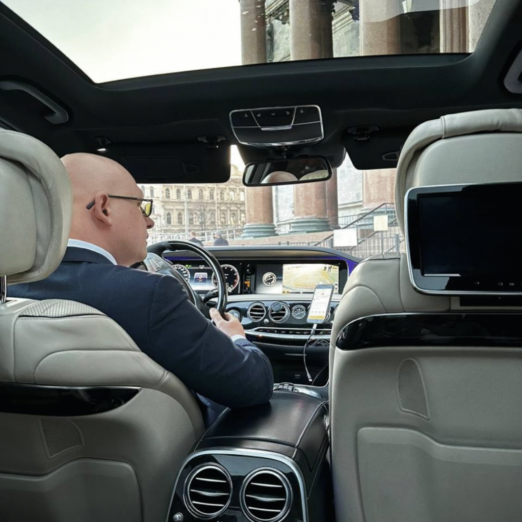 Elderly passenger being assisted by a private driver